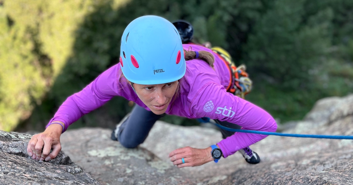 A rock climber learning during a climbing progression series course