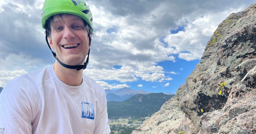 A rock climber at the top in Estes Park Colorado