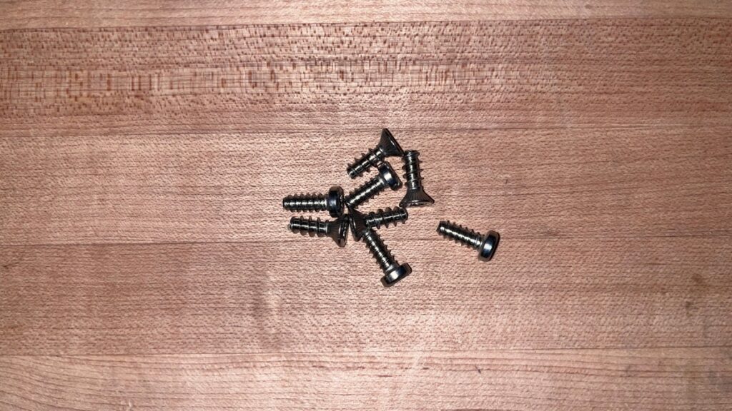 Spare screws for bindings in a backcountry ski repair kit