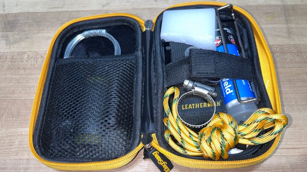 A backcountry ski repair kit in its case